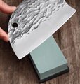 Cleaver knife on a sharpening stone