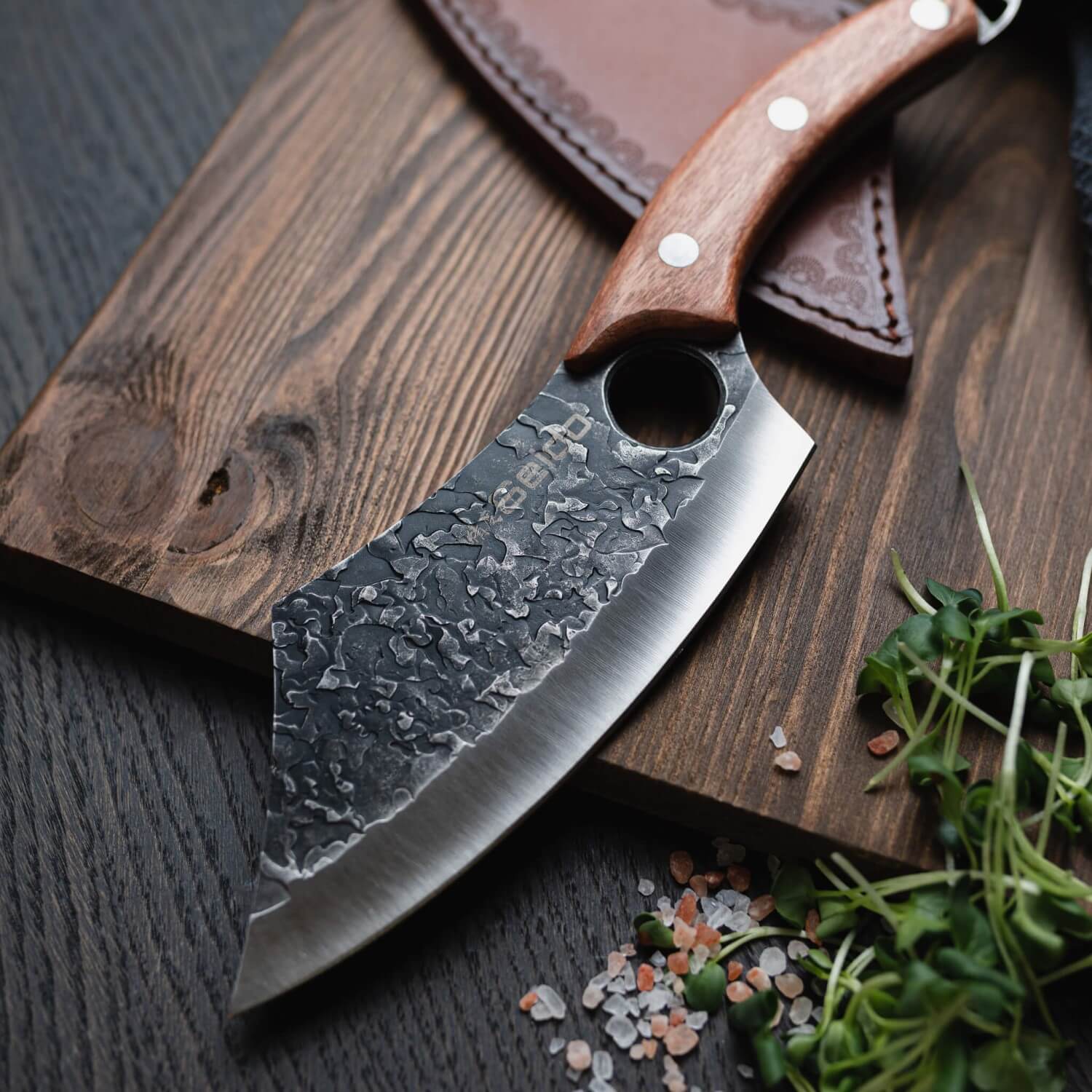 Behold the elegance of the Hakai Cleaver Knife from Seido Knives, with its wooden handle, poised on a cutting board. 