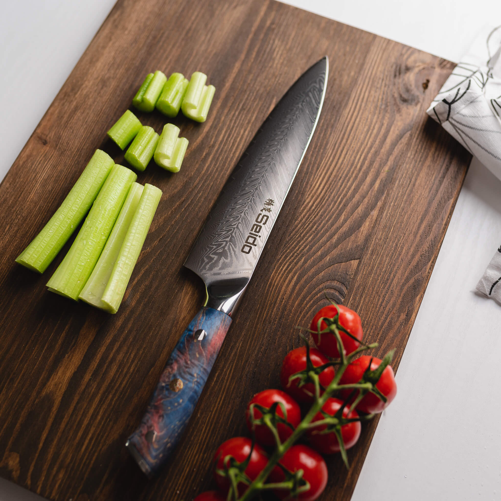 A sharp Katsuryoku Gyuto Chef Knife from Seido Knives skillfully slices through fresh vegetables on a cutting board.